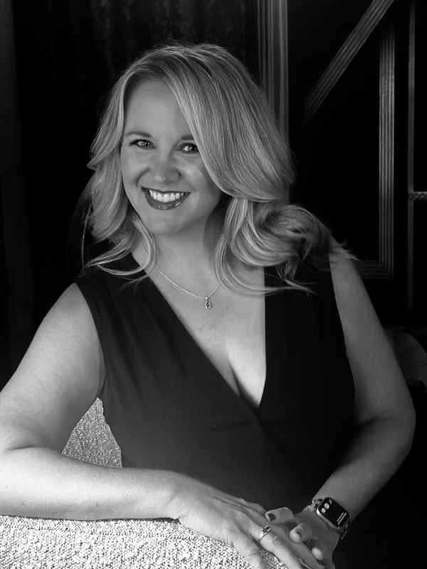 Black and white professional headshot of one of our country cover artists for events smiling to camera for picture | Altus Entertainment